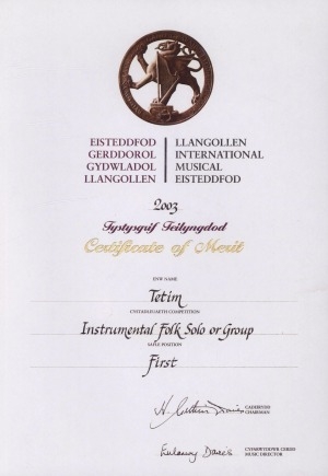 Обложка Электронного документа: Certificate of merit for first position in the competition of instrumental folk groups on Llangollen international musical eisteddfod-2003 is awarded to the instrumental folk group "Tetim"
